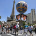 Tourists cross Las Vegas Boulevard near Paris hotel-casino on Friday, July 3, 2020, in Las Veg ...