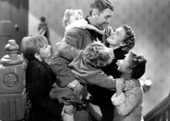 James Stewart embracing Donna Reed and four children.