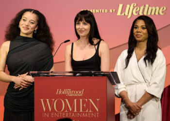 (L-R) Chase Infiniti, Dakota Johnson, and Regina Hall speak onstage during The Hollywood Reporter Women In Entertainment Presented By Lifetime at The Beverly Hills Hotel on December 03, 2025 in Beverly Hills, California.