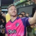 David Miller takes a selfie with fans while wearing Paarl Royals jersey after a cricket match in 2025.