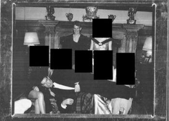 A photograph of ex-Prince Andrew lying on women's laps with Jeffrey Epstein associate Ghislaine Maxwell smiling in the background.