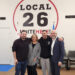 From left, union members Austin Petruzziello, Lauren Casello, Joe Baio and union President Carlos Aramayo pose for a photo after announcing a new contract between the Fenway concession workers union and the park. (Andrea Perdomo-Hernandez/WBUR)