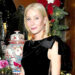 Gwyneth Paltrow poses for a photo in a black dress