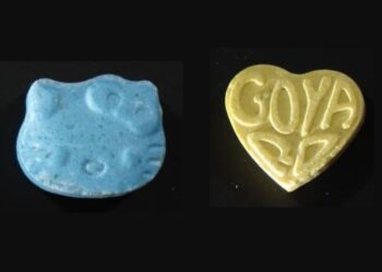 Pressed mdma pills in a Hello Kitty shape and a love heart shape.