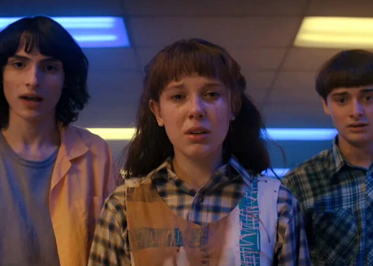 Mike, eleven, and will at the roller rink in stranger things season 4 volume 1.