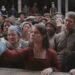 Jessie Buckley grabbing hand in Hamnet.