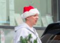 aitch in manchester with santa hat