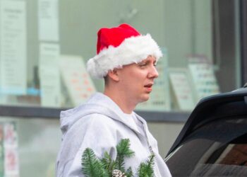 aitch in manchester with santa hat
