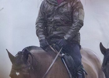 Andrew Mountbatten-Windsor rides in the rain in Windsor Park earlier this week, having not been invited the King's annual pre-Christmas bash for the extended family