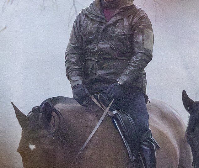 Andrew Mountbatten-Windsor rides in the rain in Windsor Park earlier this week, having not been invited the King's annual pre-Christmas bash for the extended family