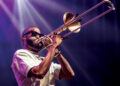 Trombone Shorty playing the trombone