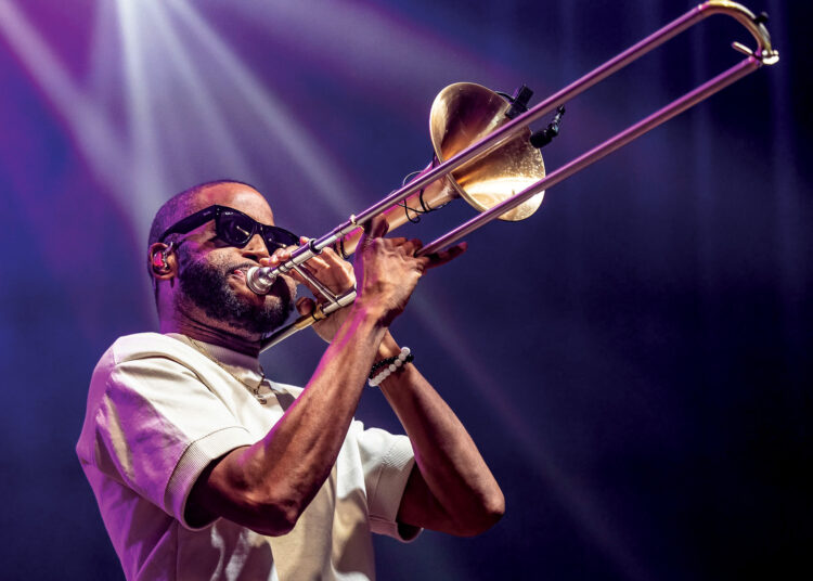 Trombone Shorty playing the trombone