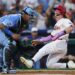 Sep 13, 2025; Philadelphia, Pennsylvania, USA; Philadelphia Phillies outfielder Harrison Bader (2) slides past the tag attempt of Kansas City Royals catcher Salvador Perez (13) for a run during the third inning at Citizens Bank Park. Mandatory Credit: Bill Streicher-Imagn Images