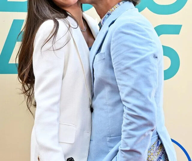 Axelle/Bauer-Griffin/FilmMagic From Left: Caitlin McHugh and John Stamos at 'The Beach Boys' premiere in May 2024