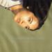 Lola Consuelos posing in front of green backdrop for single cover