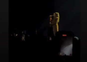a performer addressing the audience during a concert