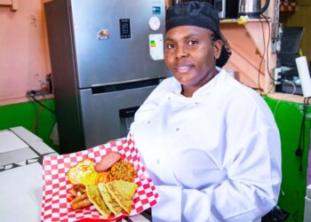 Tanisha Higgins serves up potato scones on a Scottish breakfast at her cafe in Kingston, Jamaica
