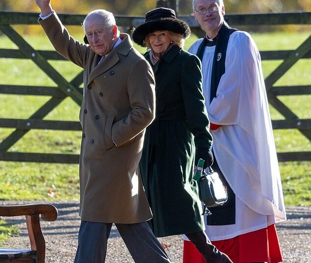 King Charles wrapped up warm, placing his hands inside his brown double-breasted overcoat, which he paired with grey suit trousers and taupe coloured loafers