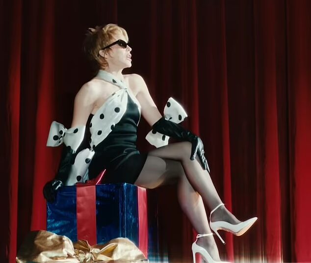 Kylie Minogue, 57, flaunted her jaw-dropping figure as she debuted the lavish music video for her new festive single XMAS on Monday