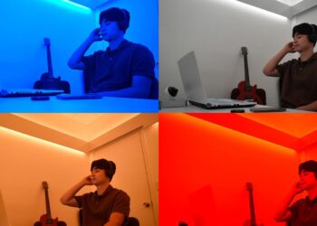 A study participant listens to music while in rooms flooded with colors of blue, musted, orangish and red