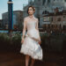 Lily Collins wearing a Schiaparelli Haute Couture gown at the Emily in Paris season 5 photocall