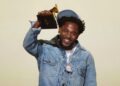 Kendrick Lamar accepts the record of the year award for