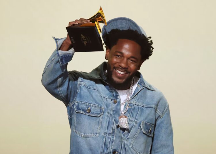 Kendrick Lamar accepts the record of the year award for