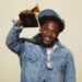 Kendrick Lamar accepts the record of the year award for