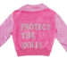 A pink jacket. On the back of it is written: Protect the Dolls.