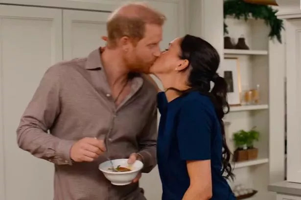 Harry and Meghan share a kiss on the show