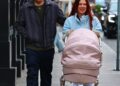 *exclusive* new york, ny **web must call for pricing** millie bobby brown, now known as millie bonnie bongiovi, and husband jake bonjovi were seen this afternoon in the west village, shopping at golden goose while strolling their daughter in a large pink stroller. milie was cozied up wearing chloe x moon boots and pushing their pink cartridge. jake showed off his blonde locks as he grabbed coffee for him and millie. pictured: millie bobby brown, jake bongiovi backgrid usa 10 december 2025 byline must read: blayzenphotos / backgrid usa: +1 310 798 9111 / usasales@backgrid.com uk: +44 208 344 2007 / uksales@backgrid.com *uk clients pictures containing children please pixelate face prior to publication*