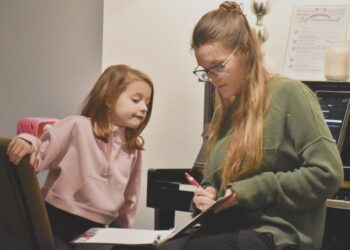 teacher working with a student