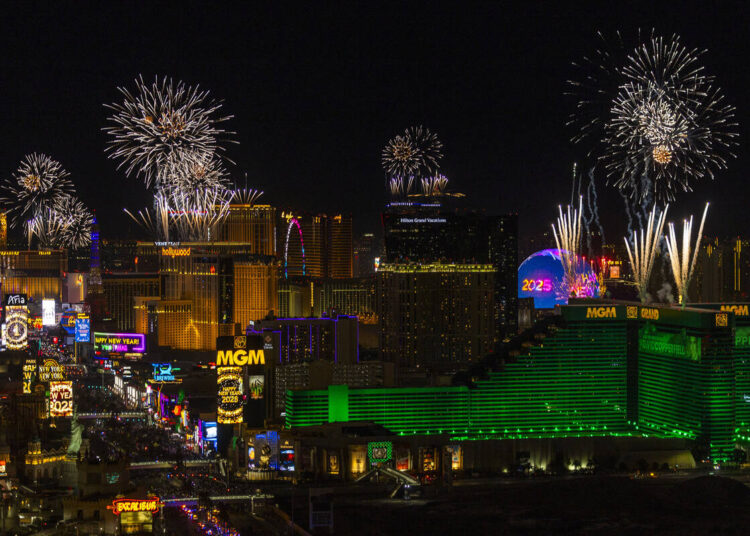 Fireworks erupt over the Strip as part of New Year's Eve celebrations across the city as v ...
