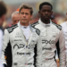 Two F1 drivers walk towards the camera
