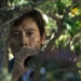 Lee Byung-hun in a tree in No Other Choice.