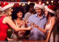 Christmas songs deemed by some to be offensive could be barred in pubs under new legislation, critics have claimed (stock image of people enjoying festive celebrations)