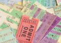 A pile of various concert tickets.
