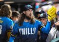 Aug 22, 2025; Philadelphia, Pennsylvania, USA; Philadelphia Phillies pitcher Matt Strahm (25) is greeted by teammates in the dugout after the seventh inning against the Washington Nationals at Citizens Bank Park.