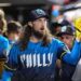 Aug 22, 2025; Philadelphia, Pennsylvania, USA; Philadelphia Phillies pitcher Matt Strahm (25) is greeted by teammates in the dugout after the seventh inning against the Washington Nationals at Citizens Bank Park.