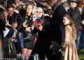 In one photo Louis can be seen clinging onto a giant Lindor chocolate - which appeared to have been a gift from a member of the crowd