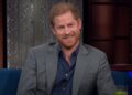 Prince Harry smiling on the Stephen Colbert's Show