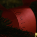 A red loop of paper with Louis written on it, created by Prince Louis