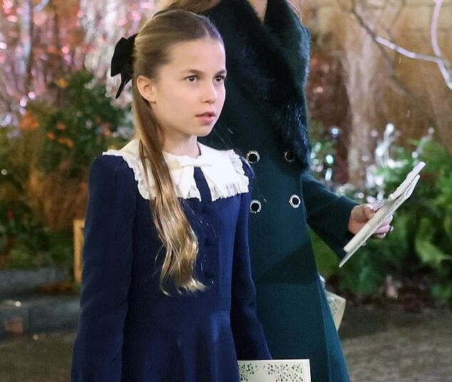 Kate's mini-me Charlotte appears to be enjoying wearing her hair in a bow this festive season, as she picked a black design for her mother's Christmas carol concert in London earlier this month