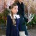 Kate's mini-me Charlotte appears to be enjoying wearing her hair in a bow this festive season, as she picked a black design for her mother's Christmas carol concert in London earlier this month
