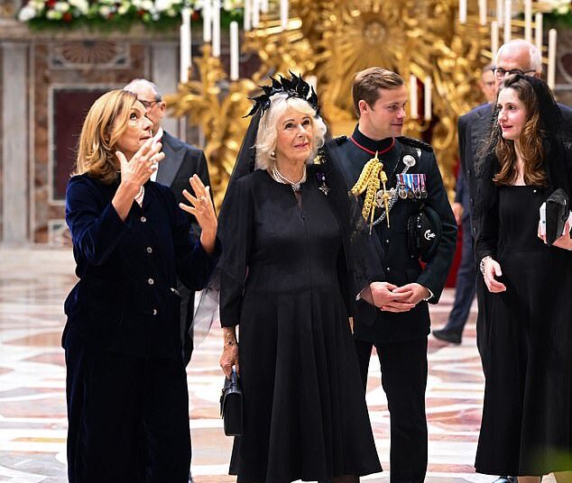 Major Ollie Plunket, pictured standing behind Queen Camilla, has served as Her Majesty's first-ever equerry since 2022