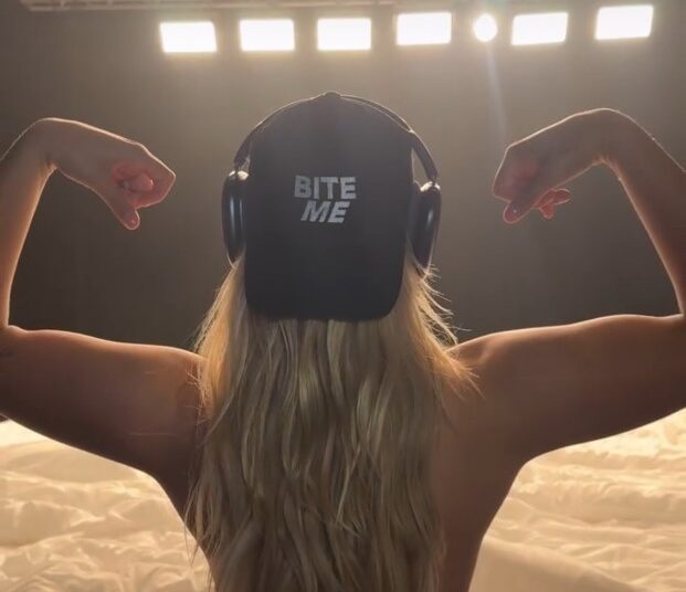 Renee Rapp flexing while teasing new music