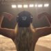 Renee Rapp flexing while teasing new music