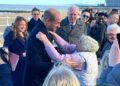 Prince William gets a hug from a wellwisher on Colwyn Bay beach in November