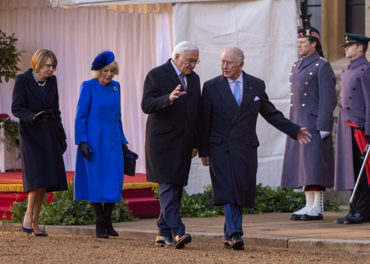 King Charles walks next to the President of Germany