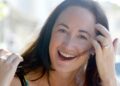 Author Sophie Kinsella poses on Wimbledon Village high street, London, Sept. 9, 2004. (AP Photo/Adam Butle, File)